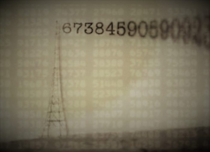 A picture of a radio tower with numbers coming from the top 