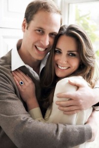 Kate's Ring Photograpgh of William and Catherine with the engagement ring clearly visible. The white gold ring has a blue sapphire center and is surrounded by 14 diamonds.