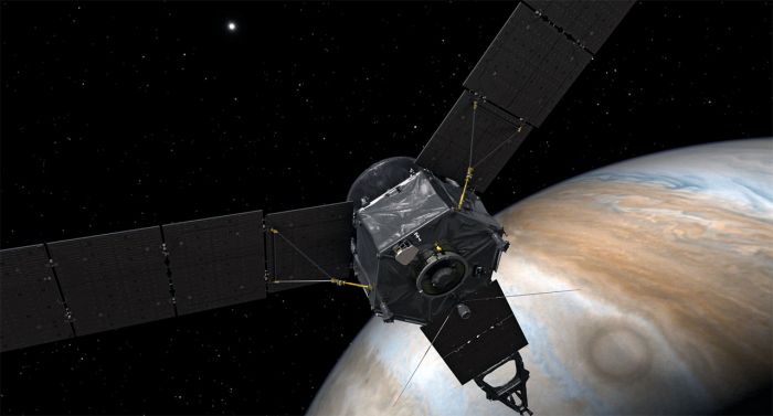 Juno spacecraft flying by the planet Jupiter.