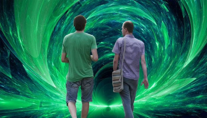 Two people walking into a portal.