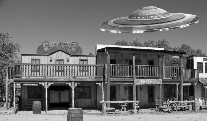 Wild West buildings with UFO flying over.