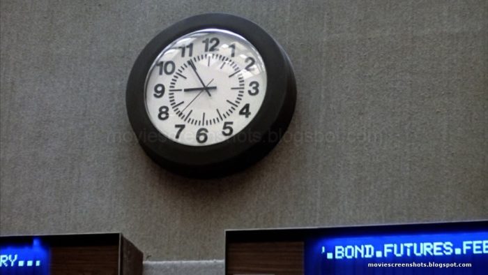 A still from the movie showing the hands of the clock at 9 and 11