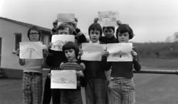Broad Haven pupils display their drawings of the UFO.