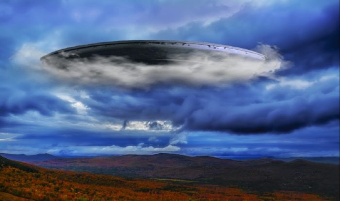 A superimposed UFO over a field