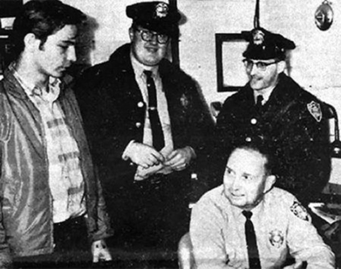 Normal Muscarello (left) with police officers