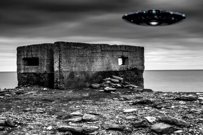 A depiction of a UFO over a war bunker