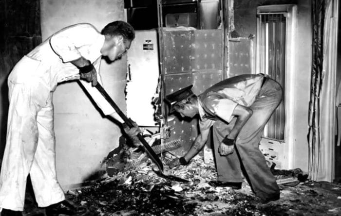 Officials clean up after the Mary Reeser incident.