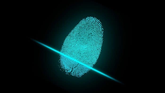 A glowing fingerprint on a black background