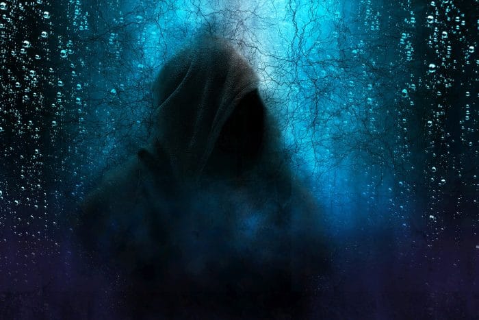 A depiction of a hooded figure