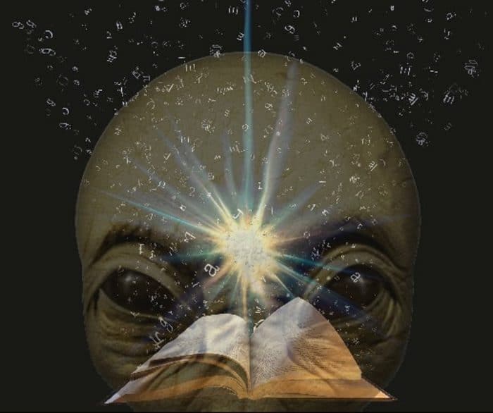 A picture of the Bible with an alien face superimposed underneath