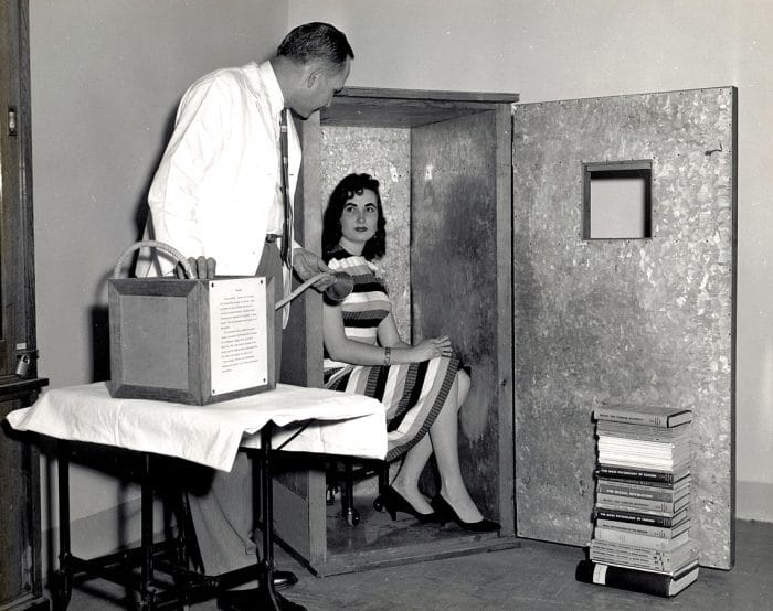 A volunteer lady sat inside the Orgone Accumulator 