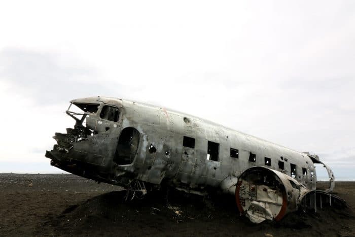 A ruin of an aircraft in a field