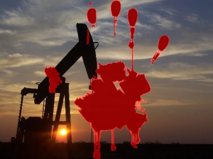 Oil Drill with a bloody handprint superimposed