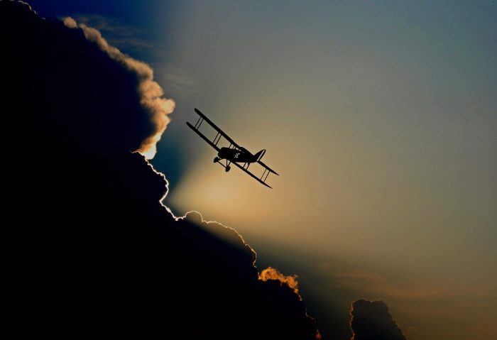 Picture of a plane approaching a cloud