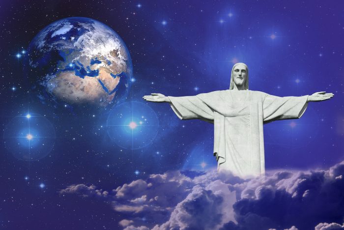 A picture of a statue of Jesus with the Earth behind it in space