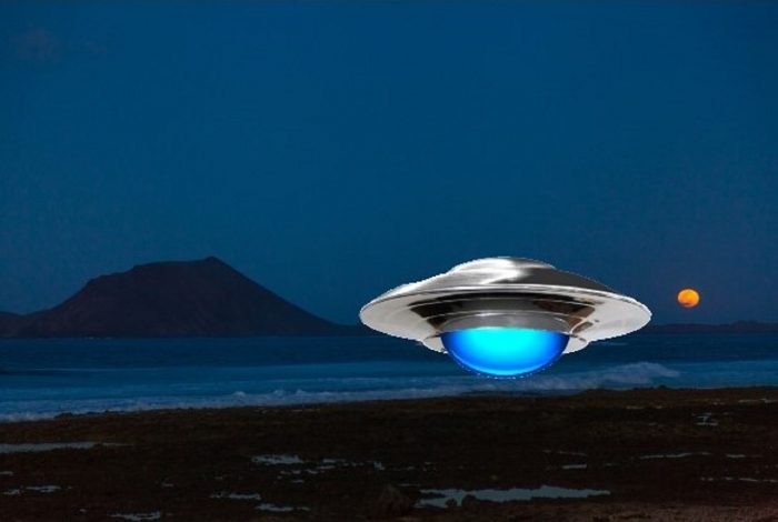 A depiction of a UFO hovering over the coast