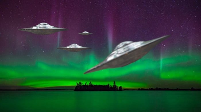 Superimposed UFOs on a night sky with aurora 