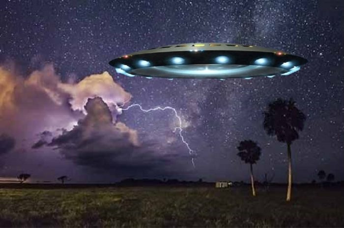 A depiction of a UFO over Florida at night