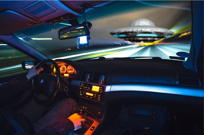 Depiction of seeing a UFO from the driver's seat of a car