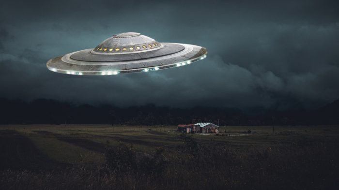 A depiction of a UFO over farm house