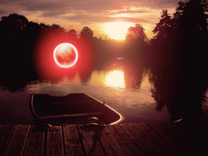 A depiction of an orb over a river