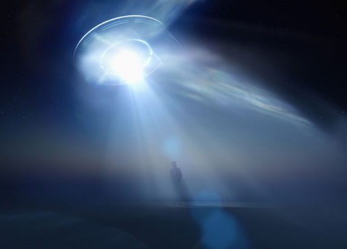 A depiction of a UFO abducting a person