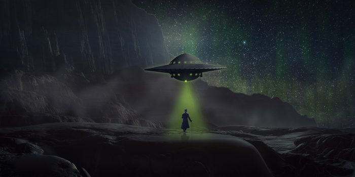 A depiction of a UFO hovering over a person