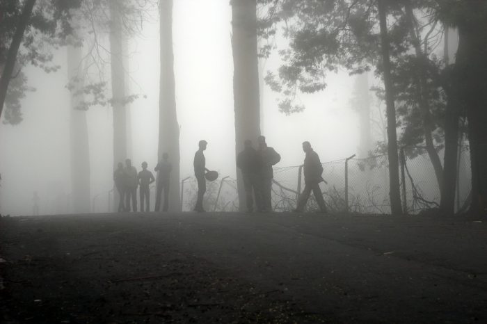 A misty scene with a search party preparing to go to work 