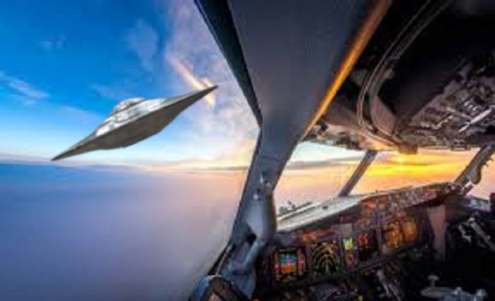 A depiction of a UFO outside a plane