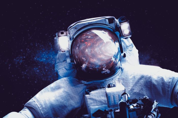 Artist's impression of an astronaut looking into a portal