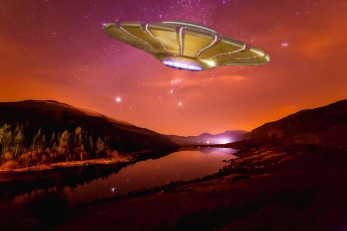 A depiction of a UFO flying over a river at night