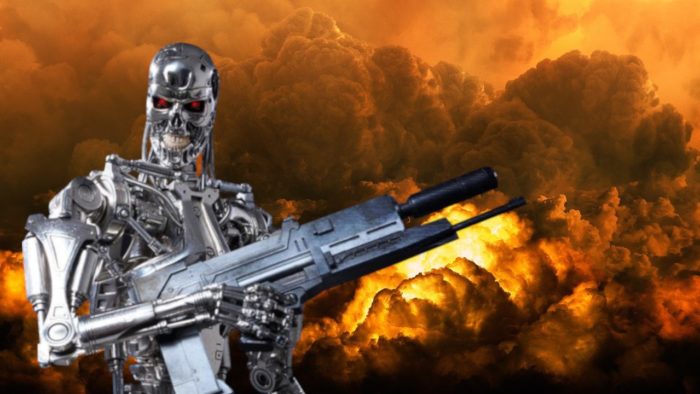 A Terminator-like robot with a gun and fire in the background