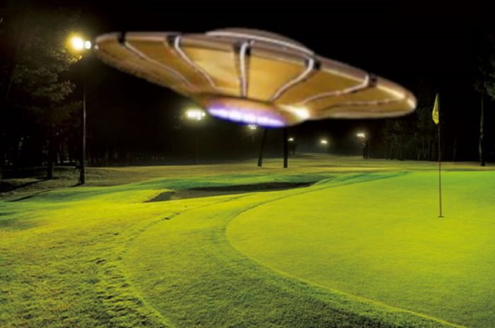 A superimposed UFO over Golf Course at night