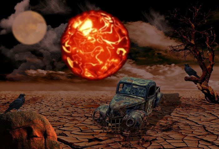 A depiction of a ruined car with a glowing orb hovering over it