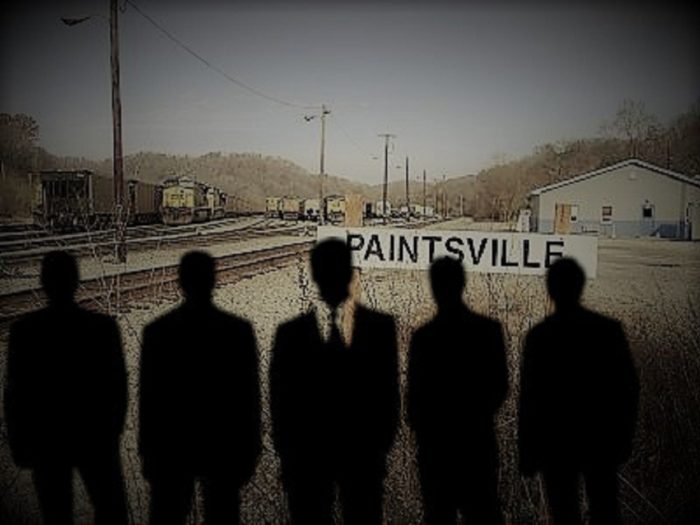 Depiction of the Men In Black over an image of Paintsville