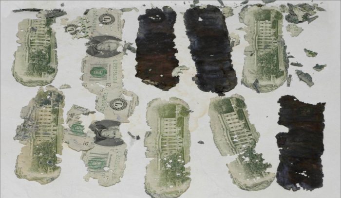 Close-up of the recovered dollar bills