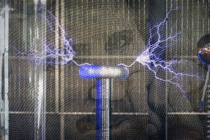 Image of Nikola Tesla with a superimposed Tesla Coil over the top