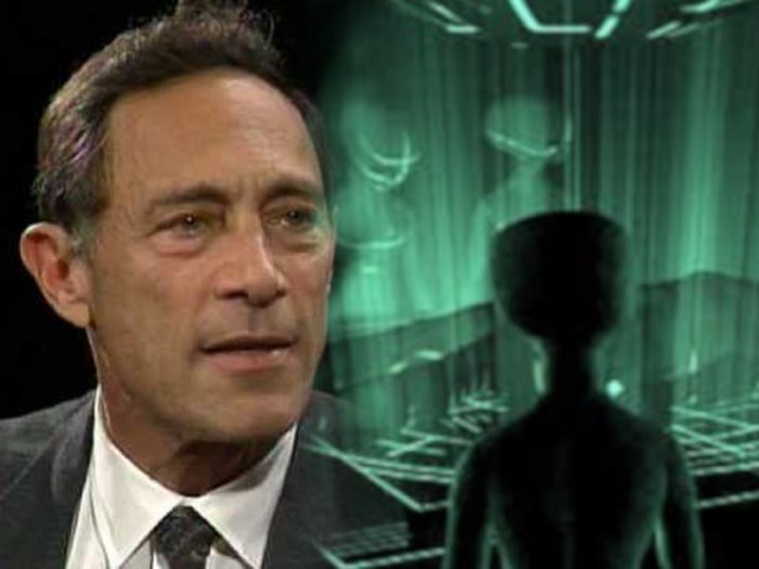 John Mack blended into a picture of an alien entity