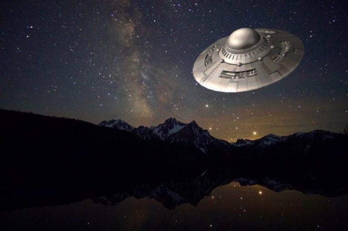 Superimposed UFO over the mountains at night