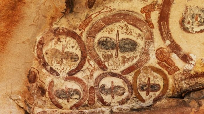 Cave painting appearing to show alien faces