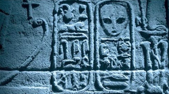 Ancient carvings appearing to show and alien