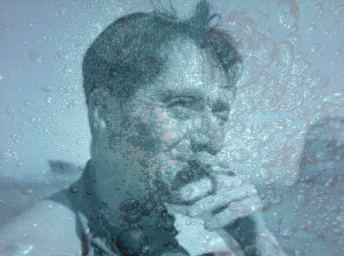 Picture of Buster Crabb with superimposed image of water over the top