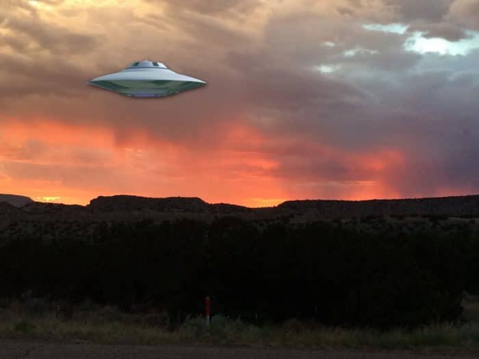 A superimposed UFO near a radio tower
