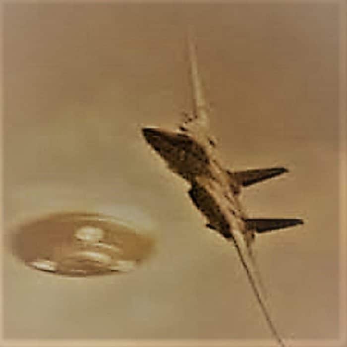 A reproduction of a UFO and military Jet in midair 