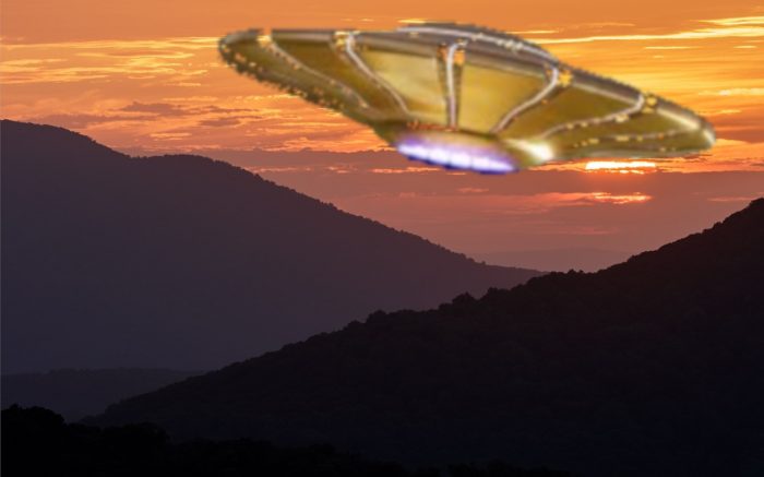 A depiction of a golden UFO flying over the mountains