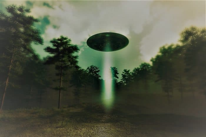 A depiction of a UFO over with a shining light