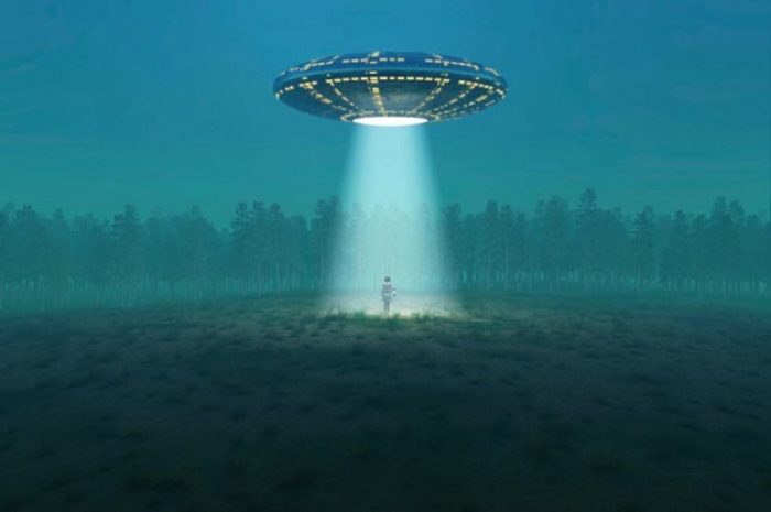 A depiction of a UFO shining a light on a person