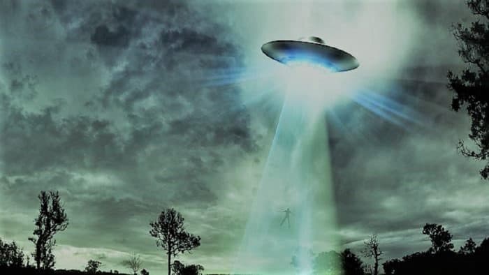 A depiction of a UFO in the cloudy sky