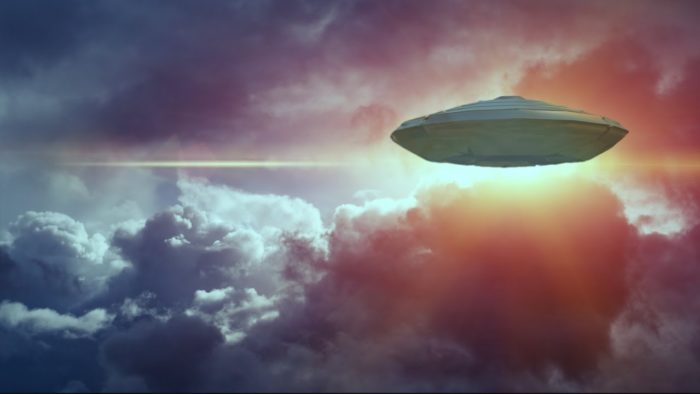 A depiction of a UFO in a cloudy sky