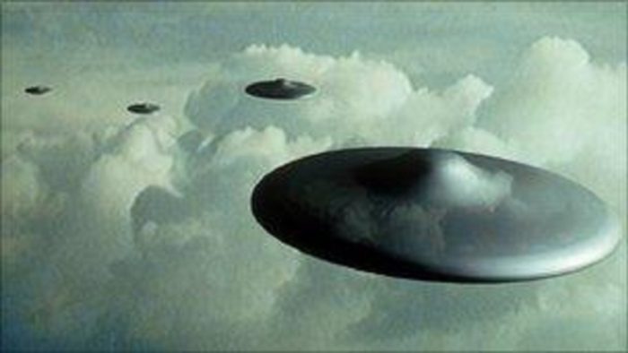 A depiction of a UFO in a cloudy sky